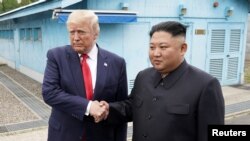 U.S. President Donald Trump meets with North Korean leader Kim Jong Un at the demilitarized zone separating the two Koreas, in Panmunjom, South Korea, June 30, 2019.