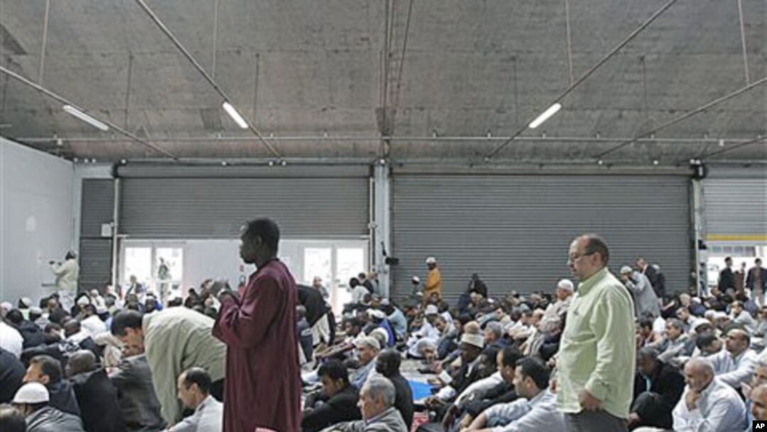 French Muslims attend a mass prayer at a prayer hall in a unused former fire station, Paris, September 16, 2011.