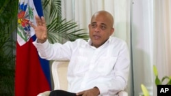 FILE - Then-Haitian President Michel Joseph Martelly speaks during an interview at the National Palace in Port-au-Prince, Haiti, on Dec. 21, 2015. The U.S. Treasury Department on Aug. 20, 2024, imposed sanctions on Martelly over drug trafficking.