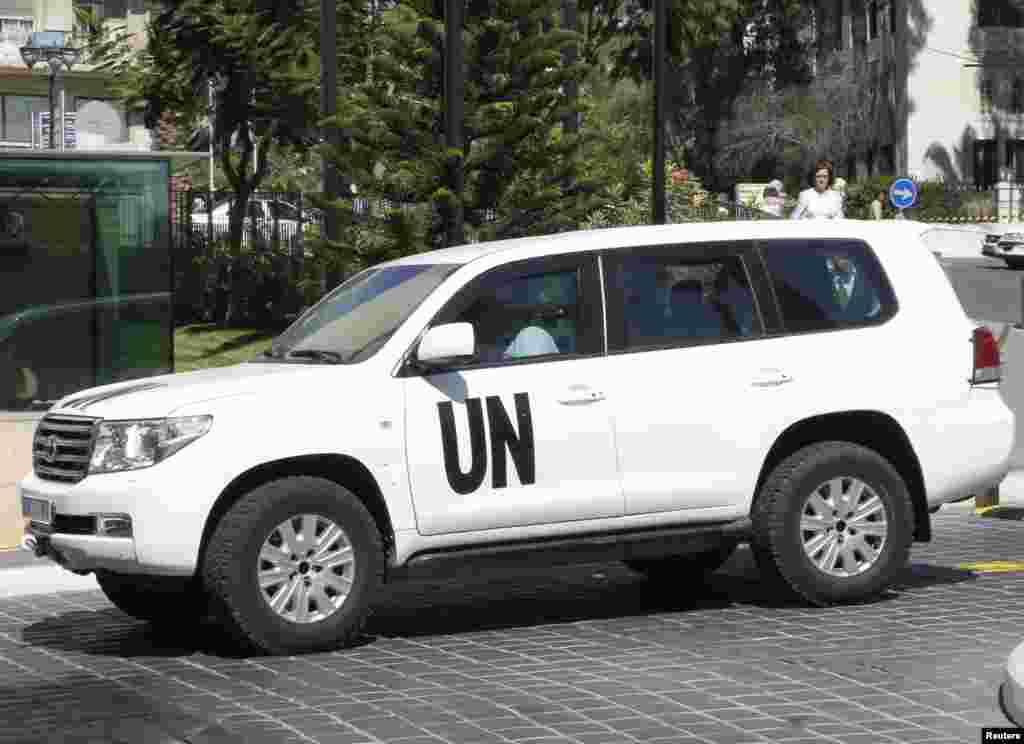 A U.N. vehicle transporting a team of experts from the Organization for the Prohibition of Chemical Weapons returns to a hotel in Damascus, Oct. 7, 2013. 