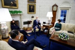 FILE - U.S. President Joe Biden and Vice President Kamala Harris meet with a group of Republican Senators to discuss coronavirus federal aid legislation inside the Oval Office at the White House, Feb. 1, 2021.
