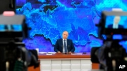 Russian President Vladimir Putin speaks via video connection during a news conference in Moscow, Russia, Dec. 17, 2020. This year, Putin held his annual news conference online due to the coronavirus pandemic. 