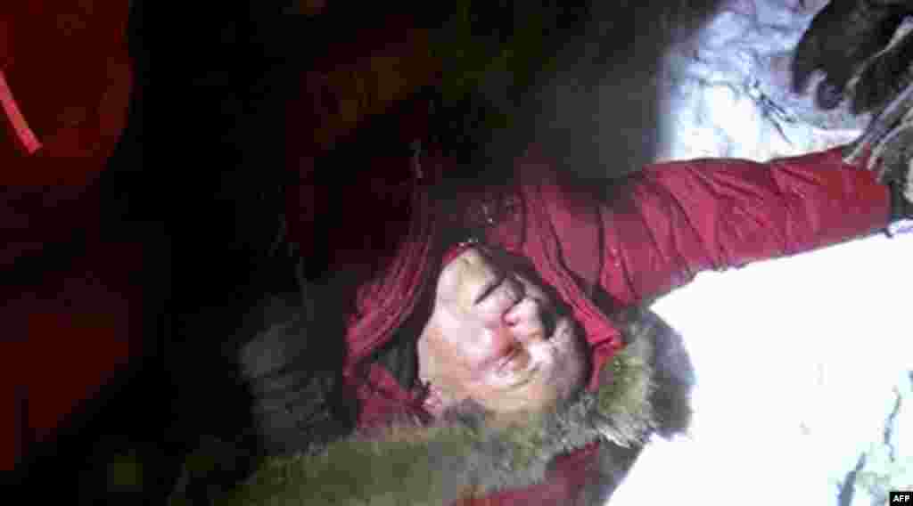 In this image made off video footage, one of the presidential candidates Vladimir Neklyaev lies as he was beaten before an opposition rally in Minsk, Berlarus, early Monday, Dec. 20, 2010. Thousands of opposition supporters in Belarus tried to storm the m