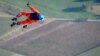 Initiator of sun-powered stratospheric SolarStratos plane project Raphael Domjan dives during a successful world record attempt by jumping with a parachute from a solar-powered plane, in Payerne, western Switzerland.