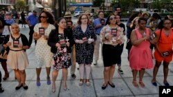 People gather as community leaders speak during the End Gun Violence Candlelight Vigil in recognition of Gun Violence Awareness Month, Wednesday, June 1, 2016, in New York. (AP Photo/Julie Jacobson)