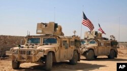 U.S. forces take up positions on the outskirts of the Syrian town, Manbij, a flashpoint between Turkish troops and allied Syrian fighters and U.S.-backed Kurdish fighters, March 7, 2017.