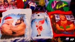 Shirts designed by artist Paul Middleton are on display in a shop at the LGBTQ+ Christmas market Christmas Avenue at Nollendorfplatz in Berlin, Nov. 25, 2024. 