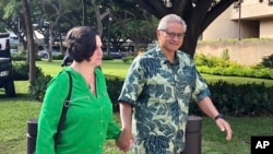 FILE - Retired Honolulu police chief Louis Kealoha and his wife, former deputy city prosecutor Katherine Kealoha, walk to the U.S. district court in Honolulu, Hawaii, March 12, 2019.