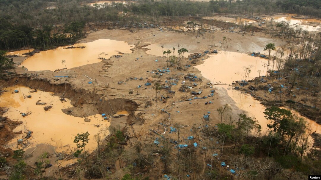 FILE - An area deforested by illegal gold mining is seen in a zone known as Mega 13, at the southern Amazon region of Madre de Dios, Peru, Jan. 25, 2014. 