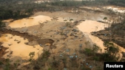 FILE - An area deforested by illegal gold mining is seen in a zone known as Mega 13, at the southern Amazon region of Madre de Dios, Peru, Jan. 25, 2014. 