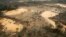 FILE - An area deforested by illegal gold mining is seen in a zone known as Mega 13, at the southern Amazon region of Madre de Dios, Peru, Jan. 25, 2014. 