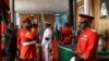 Kenyan military officers in ceremonial uniform stand guard and pay their respects as the body of former president Daniel arap Moi lies in state at the parliament building in downtown Nairobi, Kenya, Feb. 8, 2020.