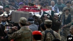 People attend the funeral of a Pakistani soldier in Lahore, Pakistan, Dec. 13, 2017. 