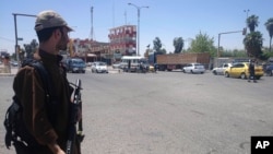 A fighter with the al-Qaida-inspired Islamic State of Iraq and the Levant (ISIL) takes control of a traffic intersection in the northern Iraqi city of Mosul, June 22, 2014.