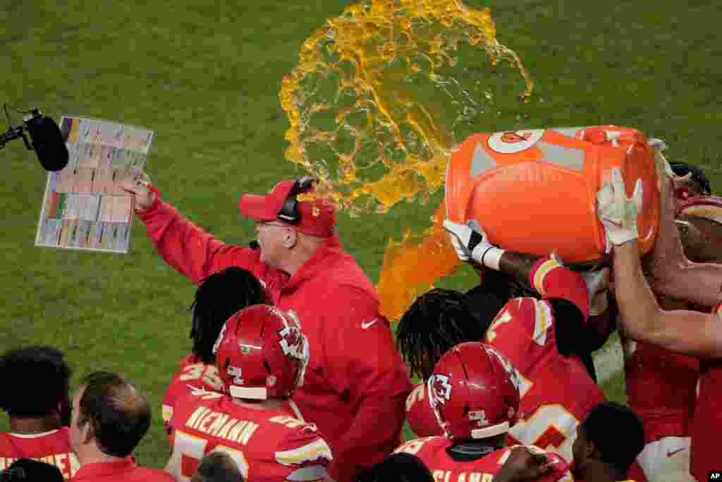 Kansas City Chiefs&#39; players pour a cooler of Gatorade on head coach Andy Reid, during the second half of the NFL Super Bowl 54 football game against the San Francisco 49ers, Feb. 2, 2020, in Miami Gardens, Fla.