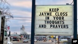 A sign is seen in the small town of Barron, Wis., Oct. 23, 2018, where 13-year-old Jayme Closs was discovered missing Oct. 15 after her parents were found fatally shot at their home.