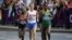 Kenya's Mary Jepkosgei Keitany, Russia's Tatyana Petrova Arkhipova and Ethiopia's Tiki Gelana, from left, compete in the women's marathon at the 2012 Summer Olympics Sunday, Aug. 5, 2012 in London. (AP Photo/Lee Jin-man)