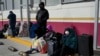 Asylum-seekers with appointments made through the U.S. Customs and Border Protection CBP One application wait at the entrance of the Camino Real International Bridge in Piedras Negras, Coahuila, Mexico, Jan. 20, 2025.