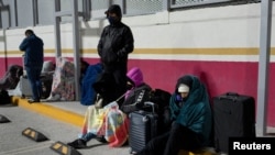 Asylum-seekers with appointments made through the U.S. Customs and Border Protection CBP One application wait at the entrance of the Camino Real International Bridge in Piedras Negras, Coahuila, Mexico, Jan. 20, 2025.