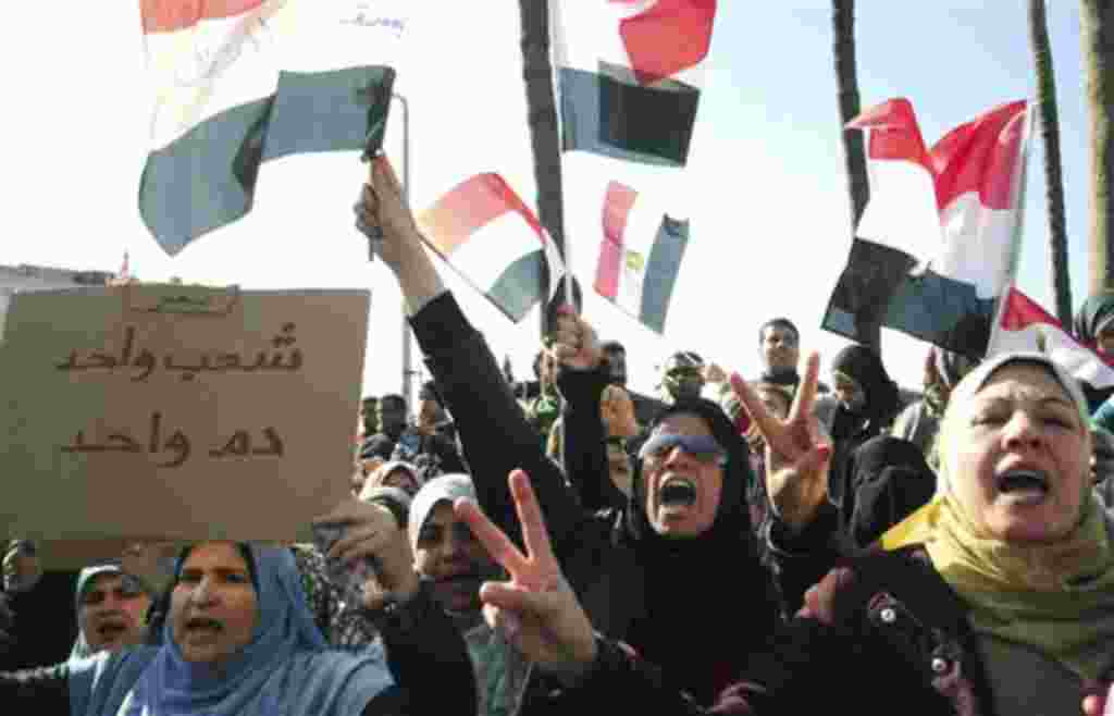 Egyptian anti-Mubarak protesters shout slogans as they march in Alexandria, Egypt, Feb 8, 2011