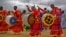 Members of the International Apostolic Ejuwel Jekenisheni Church dance, sing, pray, and play drums during a morning service at the open-air church on the outskirts of Harare, Zimbabwe Sunday, Nov. 19, 2017. (AP)