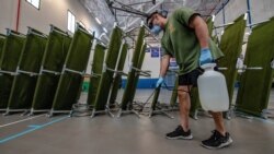 FILE - Hospital Corpsman 1st Class Frank Rivera assigned to 3rd Medical Battalion, 3rd Marine Logistics Group, sterilizes a building from coronavirus disease (COVID-19) in support of USS Theodore Roosevelt at Naval Base Guam, April 9, 2020.