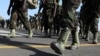 FILE - Members of the Eastern Africa Standby Brigade from Uganda march to board a French tactical aircraft C160 Transall at the French Air Base 188 in Djibouti, Dec. 5, 2009. 