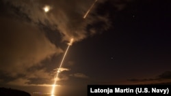 FILE - A medium-range ballistic missile target is launched from the Pacific Missile Range Facility in Kauai, Hawaii August 29, 2017. The target was successfully intercepted by SM-6 missiles fired from the guided-missile destroyer. (US Navy photo by Latonja Martin)