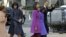 President Barack Obama, waves as he walks with his daughters Sasha and Malia, first lady Michelle Obama and mother-in-law Marian Robinson to St. John's Church in Washington, January 21, 2013, for a church service during the 57th Presidential Inauguration. 