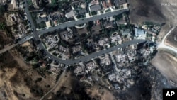 This satellite image released by Maxar Technologies shows fire-ravaged houses in Camarillo, Calif., Nov. 7, 2024. 