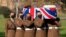 The coffin of Captain Tom Moore is carried by members of the Armed Forces during his funeral, at Bedford Crematorium, in Bedford, England, Feb. 27, 2021. 