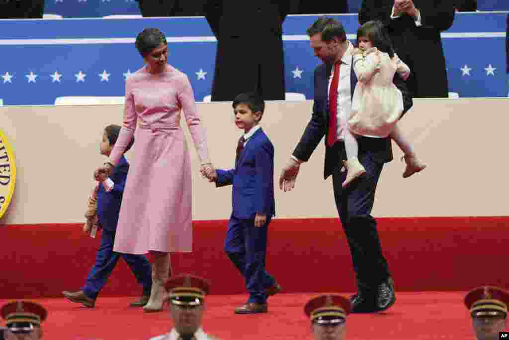 Vice President JD Vance, second right, his wife Usha Vance, second left, and their children Vivek, Ewan and Mirabel arrive at an indoor Presidential Inauguration parade event in Washington, Jan. 20, 2025.