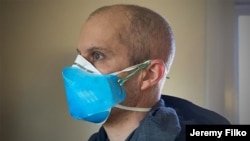 Jeremy Filko of Virginia wears one of his 3D-printed shields over a medical mask. (Photo courtesy of Jeremy Filko)