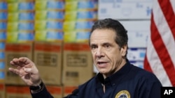 New York Gov. Andrew Cuomo speaks during a news conference against a backdrop of medical supplies at the Jacob Javits Center that will house a temporary hospital in response to the COVID-19 outbreak, March 24, 2020, in New York. 