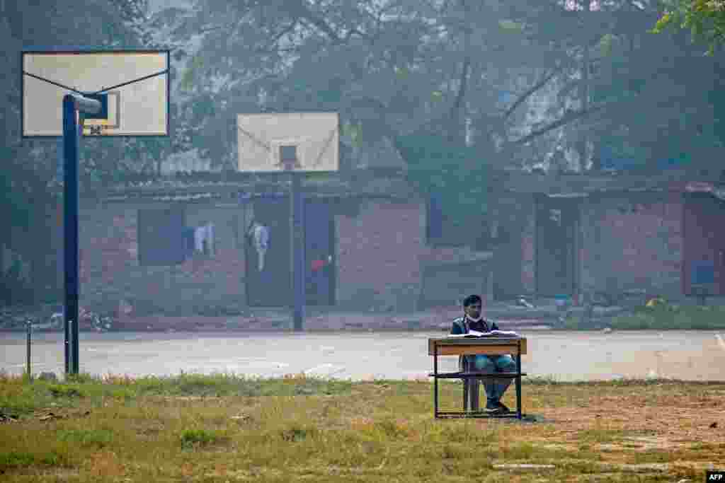 A schoolhouse  teacher   conducts an online people  adjacent   a hoops  tribunal  astatine  Swami Sivananda Memorial Institute successful  New Delhi.&nbsp;Keeping children astatine  location  and moving lessons online for days astatine  a clip  during the highest  of the smog situation  has go  an yearly  ritual successful  the area.&nbsp;