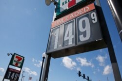 FILE - Gas prices are listed for unleaded at a gas station in Oklahoma City.
