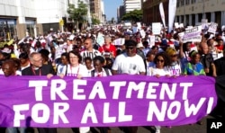 FILE - In this July 18, 2016 file photo, civil rights activists march at the start of the 21st World Aids Conference in Durban, South Africa.