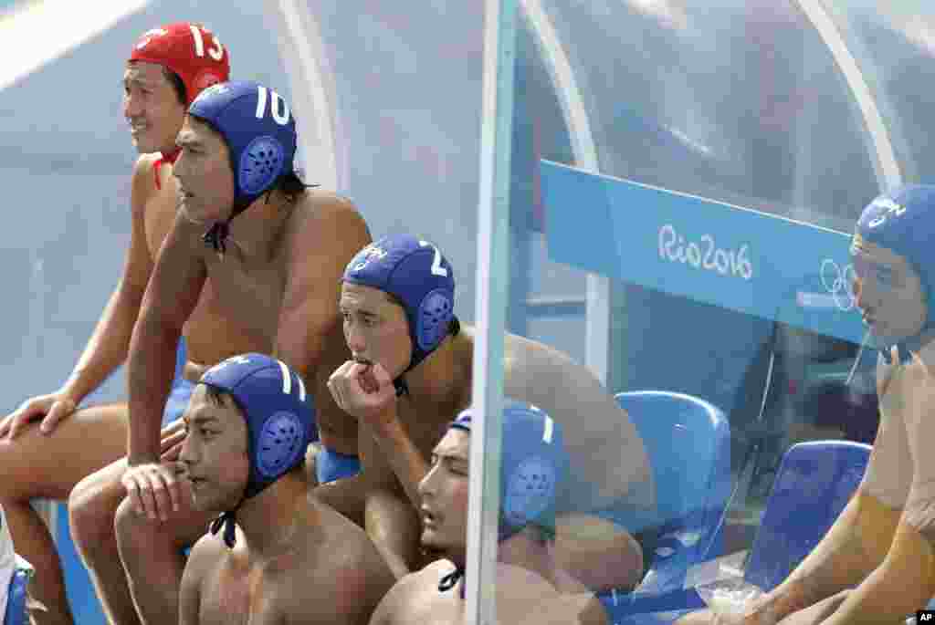 Japan players follow the game during men's water polo preliminary round match against Greece at the 2016 Summer Olympics in Rio de Janeiro, Brazil, Aug. 6, 2016. 