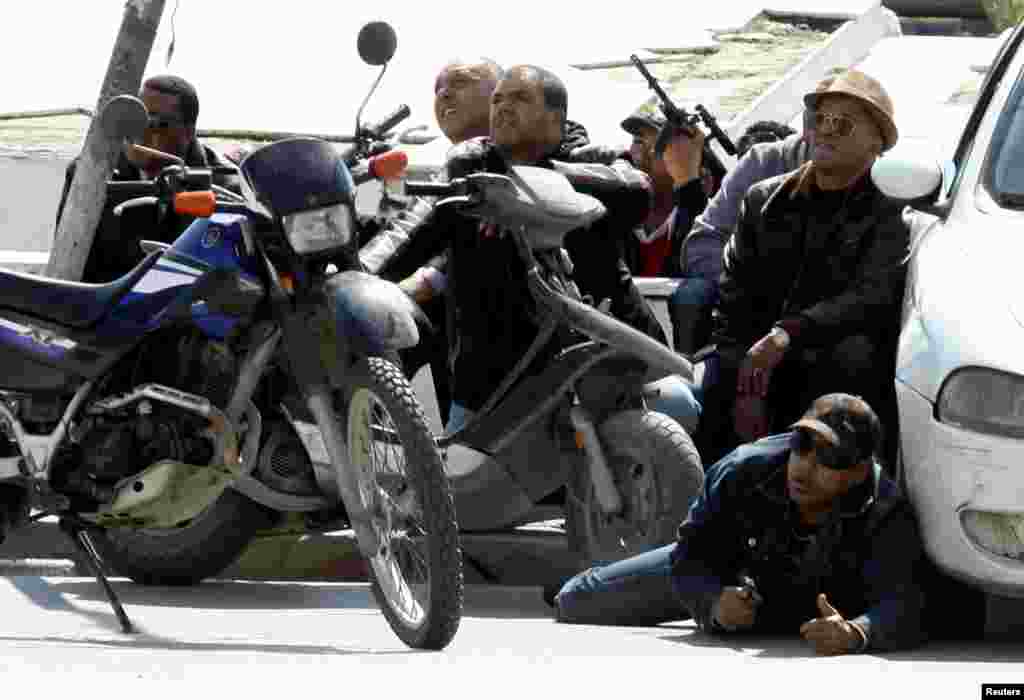 Police officers are seen on the pavement outside parliament in Tunis, March 18, 2015.