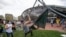 Pro-Palestinian supporters tear down the wall as they retake the encampment at the Massachusetts Institute of Technology in Cambridge, Massachusetts, on May 6, 2024. 
