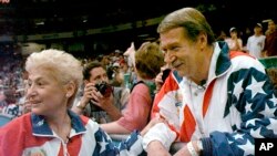 Gymnastics Doctor-Sexual Abuse: FILE - In this July 23, 2004, file photo, Martha and Bela Karolyi watch together as the U.S. women's gymnastic team celebrates winning the gold medal at the Centennial Summer Olympic Games in Atlanta. 