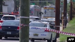 This video grab shows police cars on the site of a shooting in Jacksonville, Florida, August 26, 2023.
