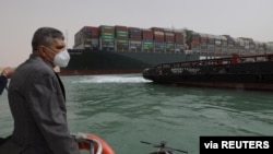 Osama Rabie, Chairman of the Suez Canal Authority, monitors the situation near stranded container ship Ever Given, one of the world's largest container ships, after it ran aground, in Suez Canal, Egypt, March 25, 2021.