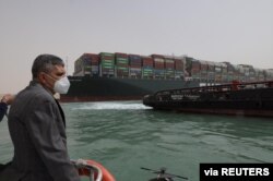 Osama Rabie, Chairman of the Suez Canal Authority, monitors the situation near stranded container ship Ever Given, one of the world's largest container ships, after it ran aground, in Suez Canal, Egypt, March 25, 2021.