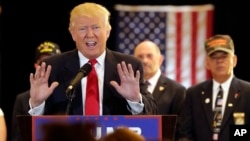 Republican presidential candidate Donald Trump answers questions about donations to veteran groups during a news conference in New York, May 31, 2016. 