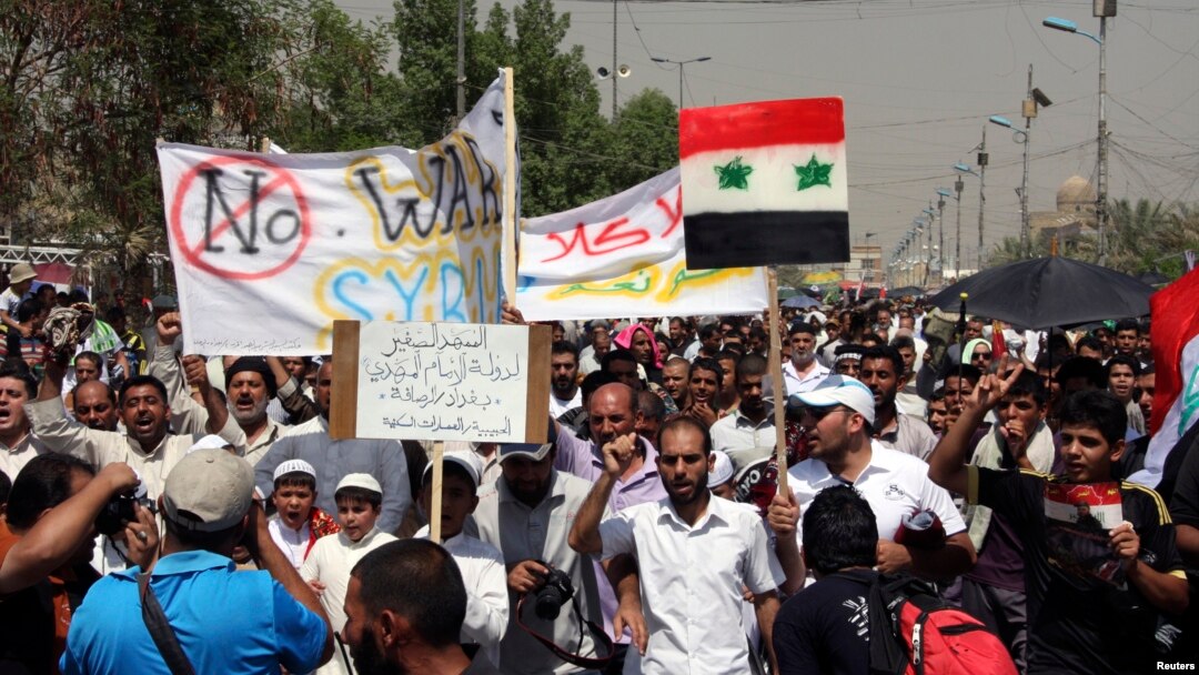 Supporters of religious and political leader Muqtada al-Sadr demonstrate against the possibility of a U.S. military strike against the Syrian government, in Baghdad's Sadr City August 30, 2013.