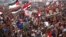 Supporters of Muslim Brotherhood's presidential candidate Mohamed Morsi celebrate his victory at Tahrir Square in Cairo, June 24, 2012. 