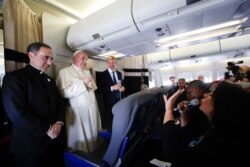 Pope Francis listens reporters questions during his flight from Antamanarivo to Rome, Sept. 10, 2019, after his seven-day pastoral trip to Mozambique, Madagascar, and Mauritius.