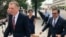 United States Trade Representative Robert Lighthizer, left, and Mexican Secretary of Economy Idelfonso Guajardo, right, walk to the White House, in Washington, Aug. 27, 2018.