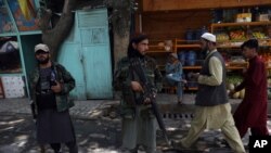 Taliban fighters stand guard at a checkpoint in the Wazir Akbar Khan neighborhood in the city of Kabul, Afghanistan, Aug. 22, 2021. 